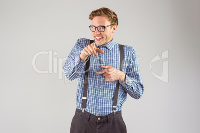 Geeky hipster pointing at camera