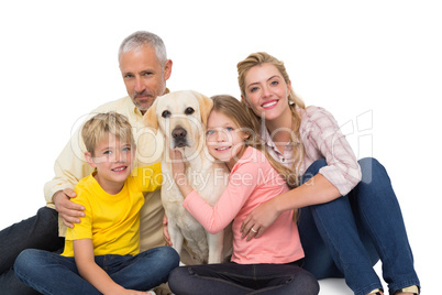 Happy family with their pet dog