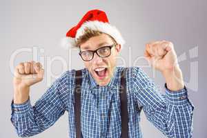 Geeky hipster wearing santa hat