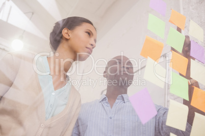 Creative business team pointing adhesive notes