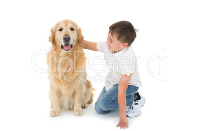 Portrait of cute boy hugging his dog