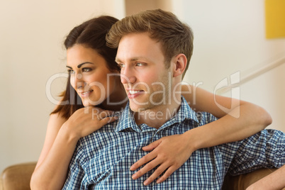Happy young couple relaxing on the couch