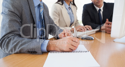 Close up of businessman taking notes