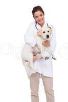 Beautiful veterinarian with a cute dog in her arms