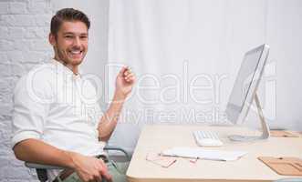 Businessman with computer at office desk