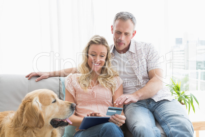 Couple with credit card shopping online