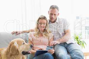 Couple with credit card shopping online