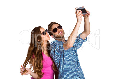 Couple taking selfie with digital camera