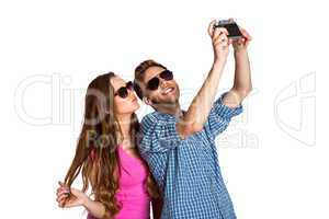 Couple taking selfie with digital camera