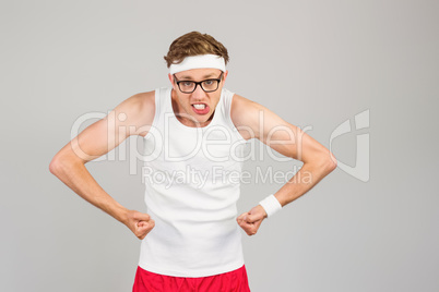 Geeky hipster posing in sportswear