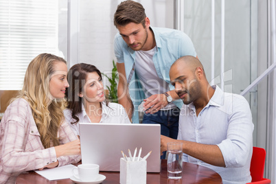 Business team working together with laptop