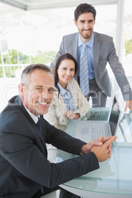 Smiling business people at work