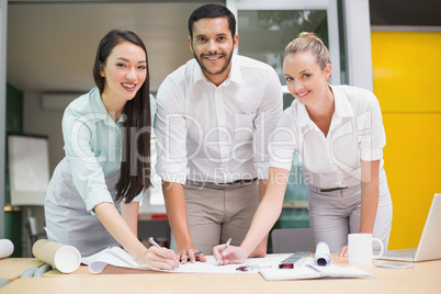 Architecture team working together at desk