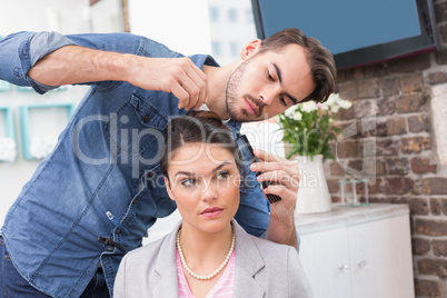 Pretty brunette getting her hair styled