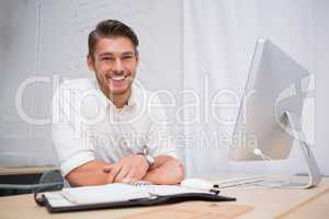 Businessman with computer at office desk