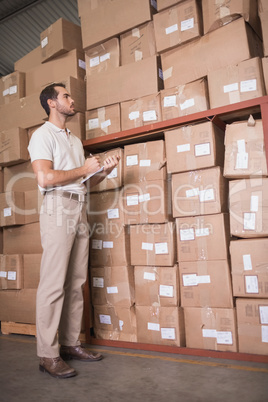 Warehouse worker with clipboard