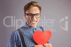 Geeky hipster covered in kisses