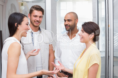 Casual business team smiling and talking