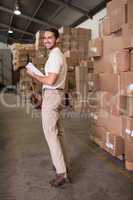 Portrait of warehouse worker with clipboard