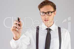 Geeky businessman writing with marker