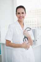 Doctor holding her stethoscope in hand