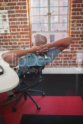 Casual businessman leaning back in chair