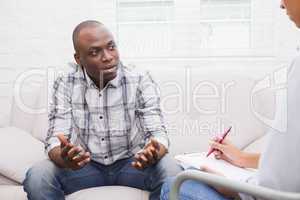 Man talking to her psychologist