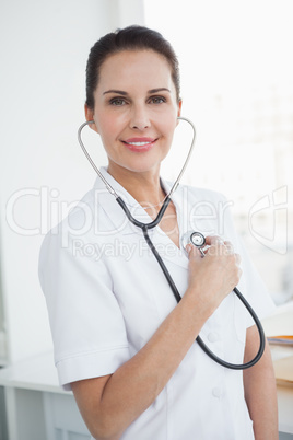Doctor checking her own heartbeat