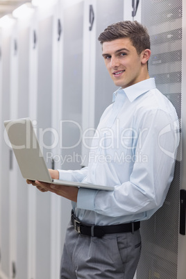 Smiling technician using his notebook