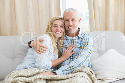 Happy couple relaxing on the couch