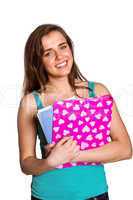 Smiling young woman with books