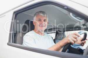 Smiling man driving van