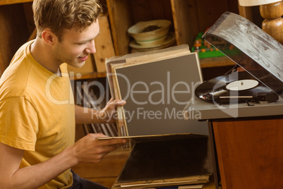 Young man looking at his vinyl collection