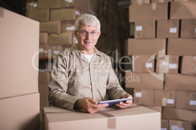 Warehouse worker using digital tablet