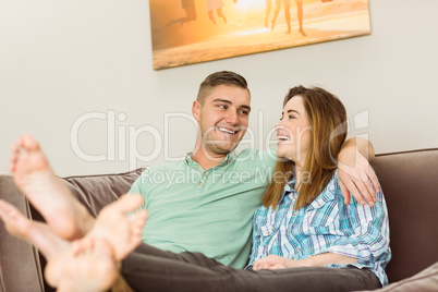 Cute couple relaxing on couch