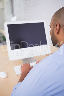 Businessman using computer at desk