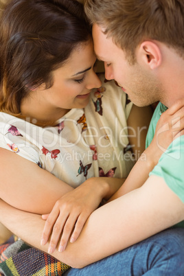 Cute couple cuddling on couch