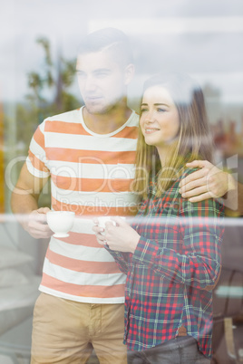 Cute couple looking out the window