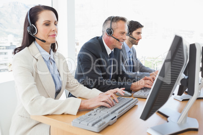 Happy businessman working with coworkers