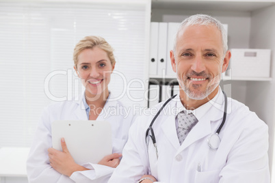 Smiling doctors coworker standing