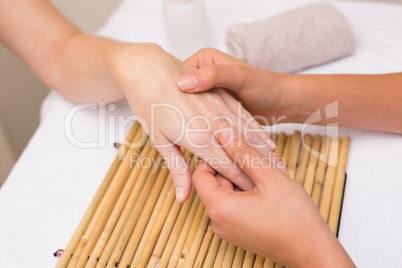 Woman getting a hand massage