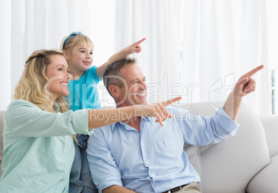 Nice parents and daughter pointing something