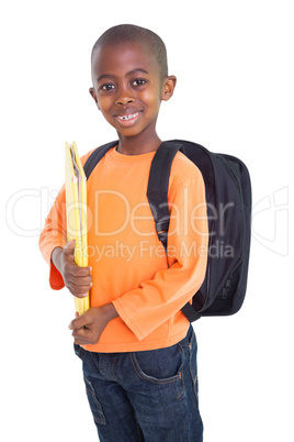 Cute elementary pupil smiling at camera