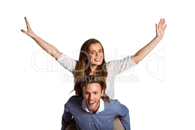 Smiling young man carrying woman