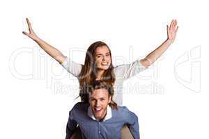 Smiling young man carrying woman