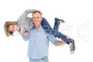 Smiling man carrying son on his shoulders