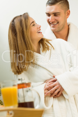 Cute couple in their bathrobes Cute couple in their bathrobes