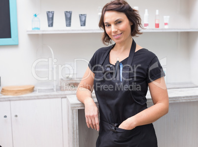 Hair stylist smiling at camera