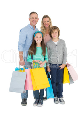 Portrait of smiling family with shopping bag