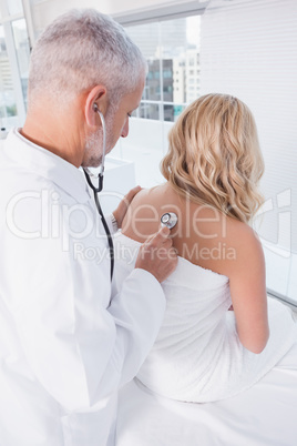 Doctor listening the breathing at his patient